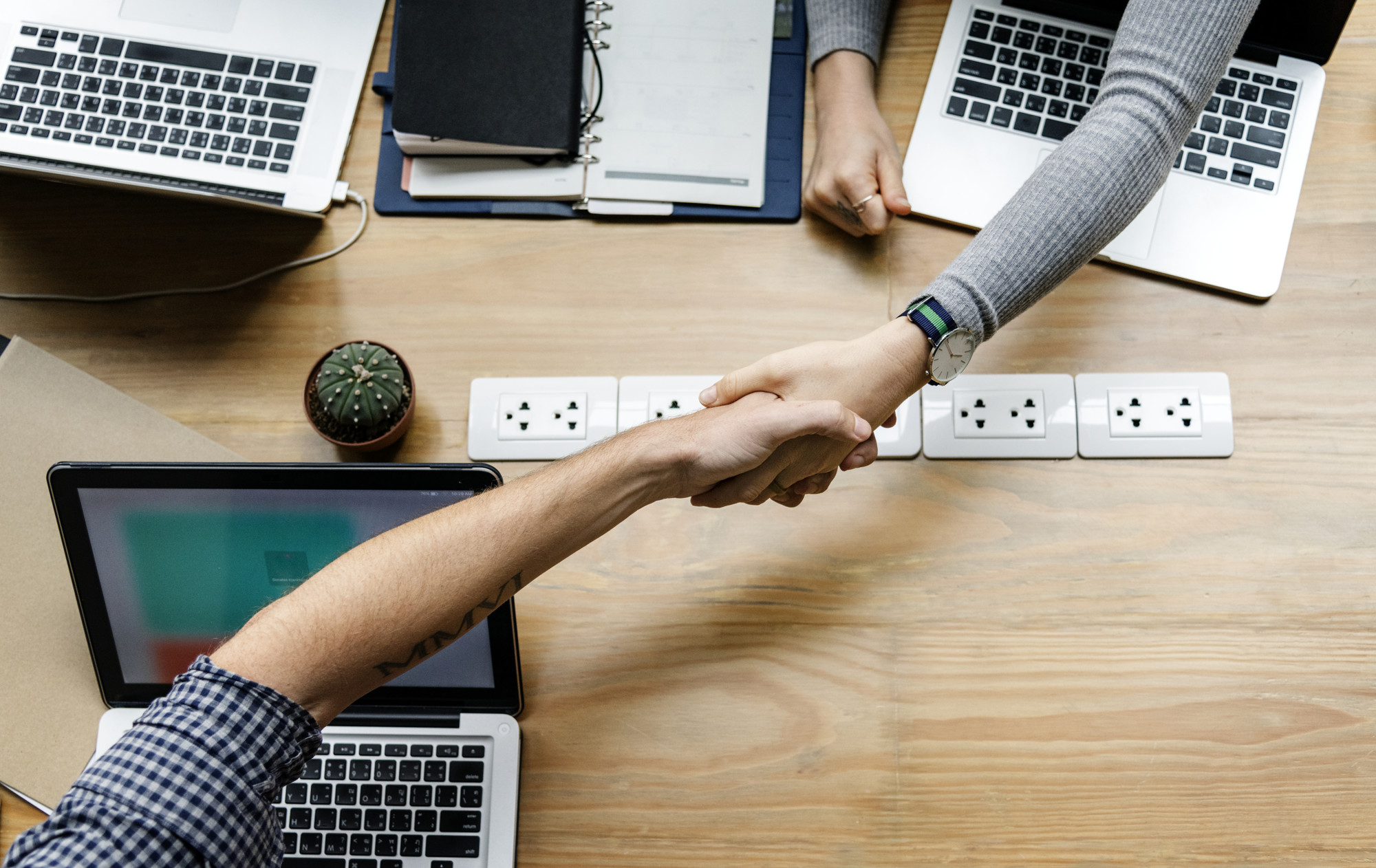 Business people shaking hands in agreement MyEMS