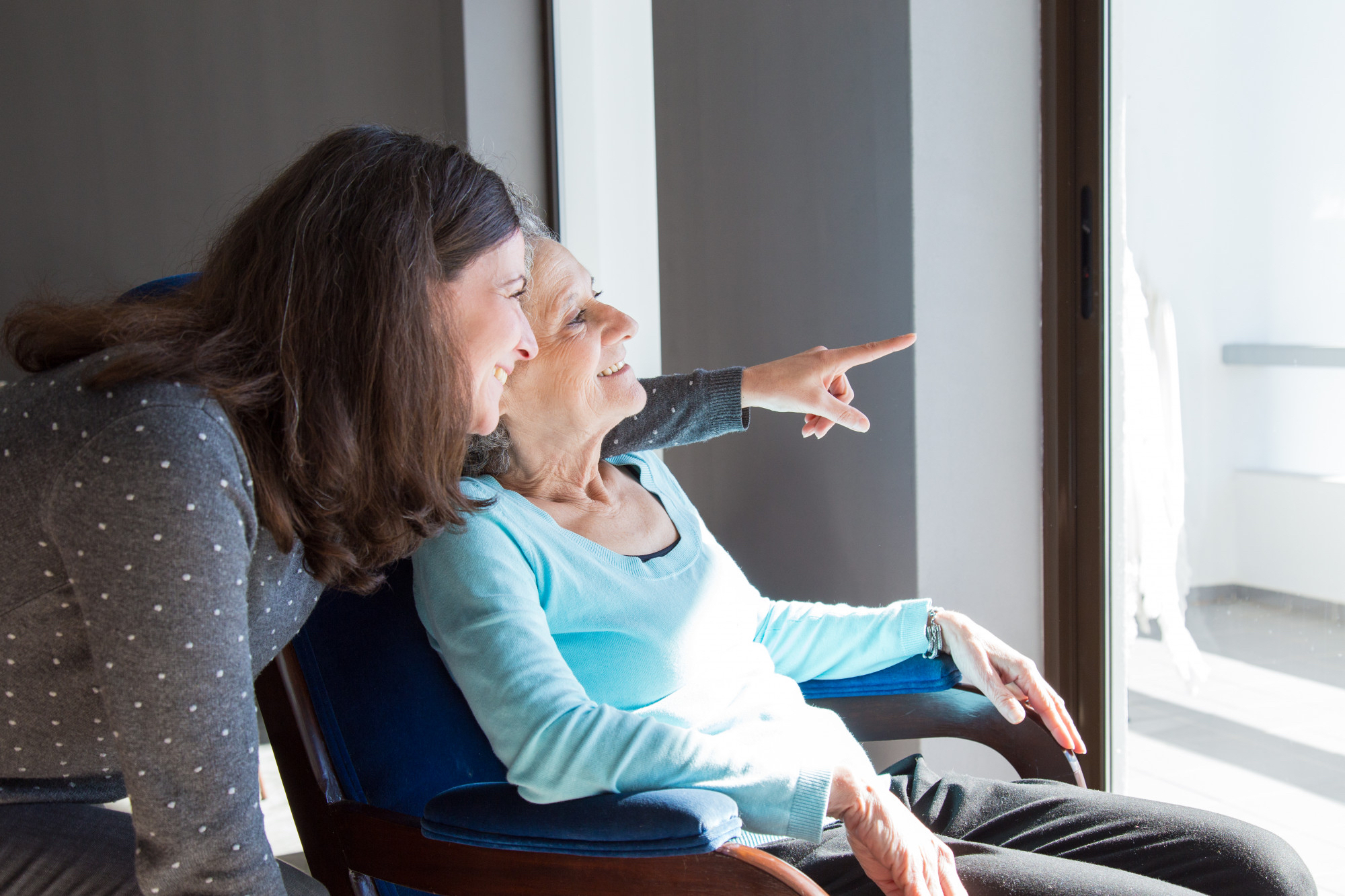 aged-care-staff-pointing-out-window-with-patient-MyEMS